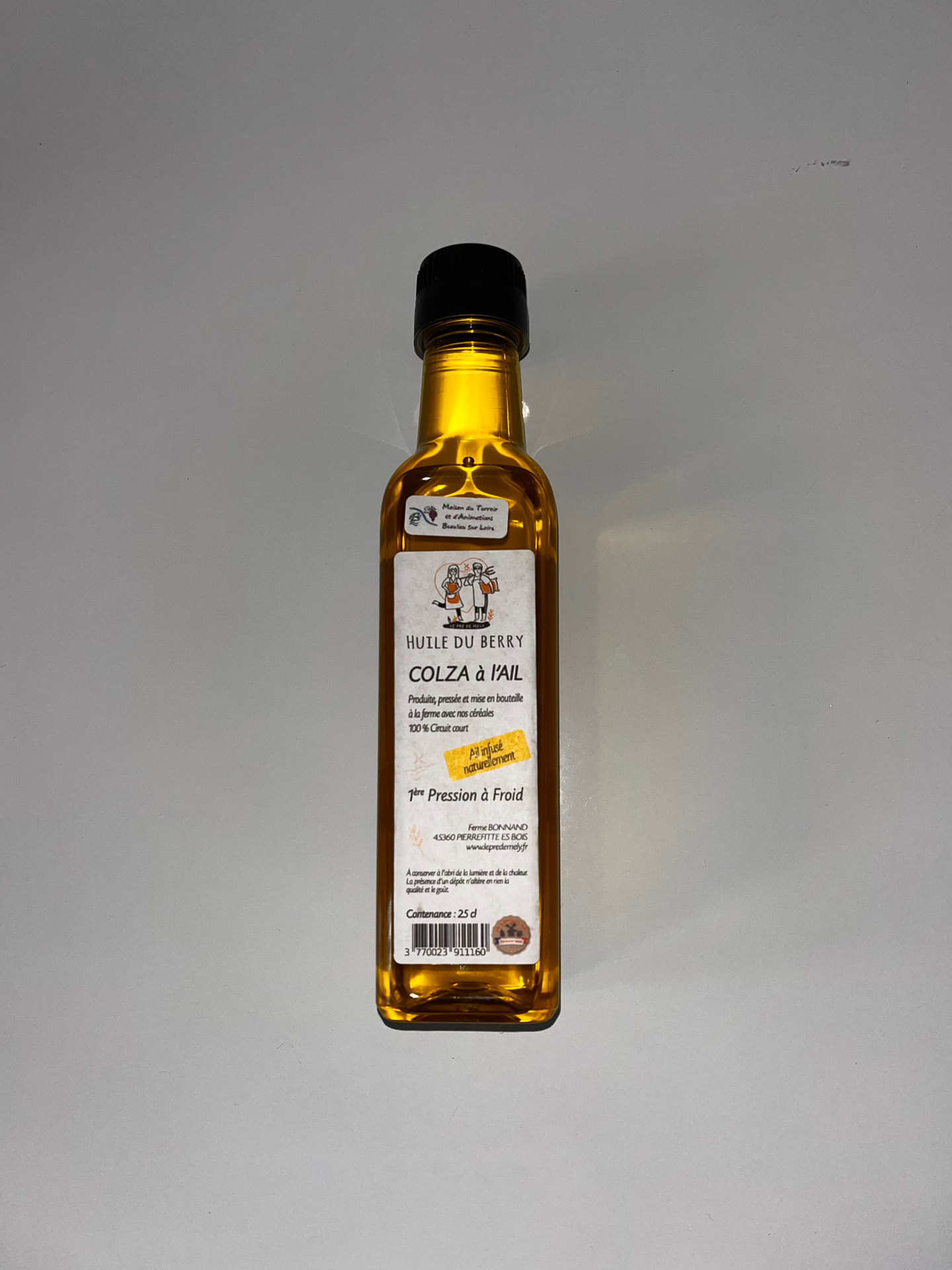 Étiquette Huile du Berry sur bouteille de colza à l'ail